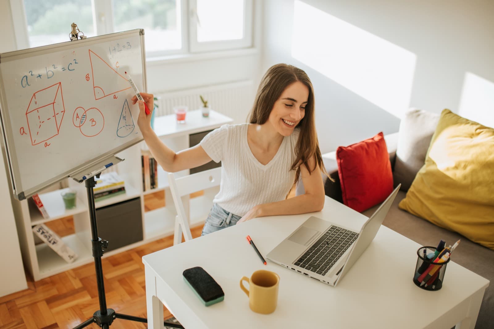 A tutor teaching a lesson online from home